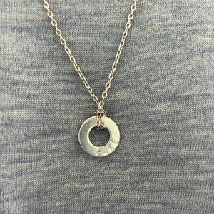 Cute silver tone necklace. FREE in the word on the necklace.